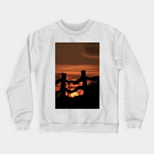 Wooden Fence with a colorful Kansas Sunset Crewneck Sweatshirt